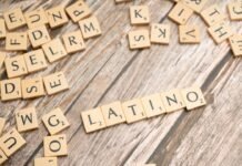 Letras del Tesoro: El Refugio Financiero que Conquista a Familias y Empresas Españolas en Tiempos de Inflación scrabble tiles spelling the word latin on a wooden surface
