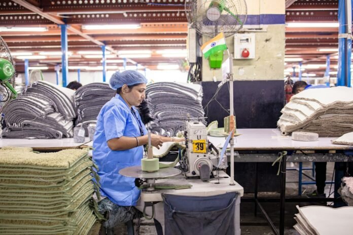 image_1790622036424 A factory worker operates a machine