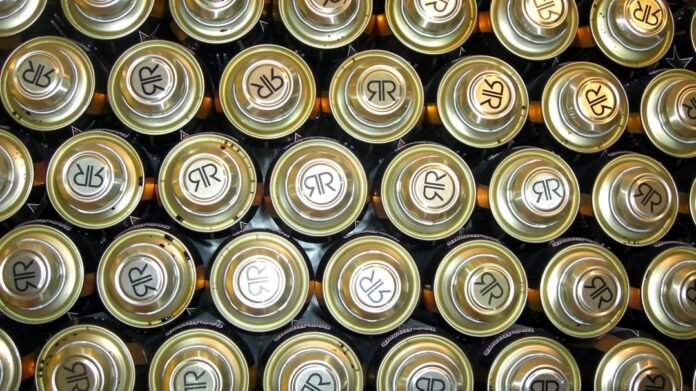 image_1790902836281 Rows of golden-topped batteries with circular symbols