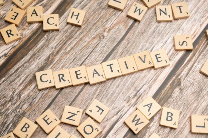 scrabble tiles spelling out the word creative
