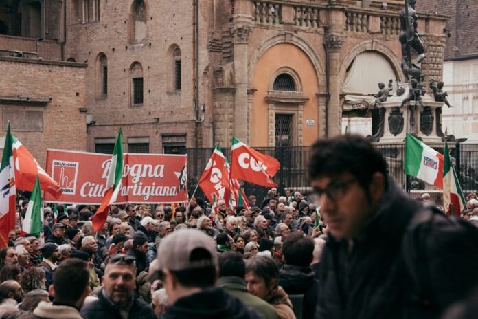 A large group of people standing in front of a building