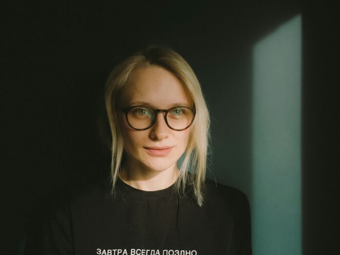 woman in black crew neck shirt wearing eyeglasses