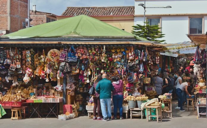 a group of people standing in front of a market