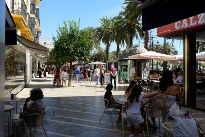 People enjoying a sunny day at an outdoor cafe