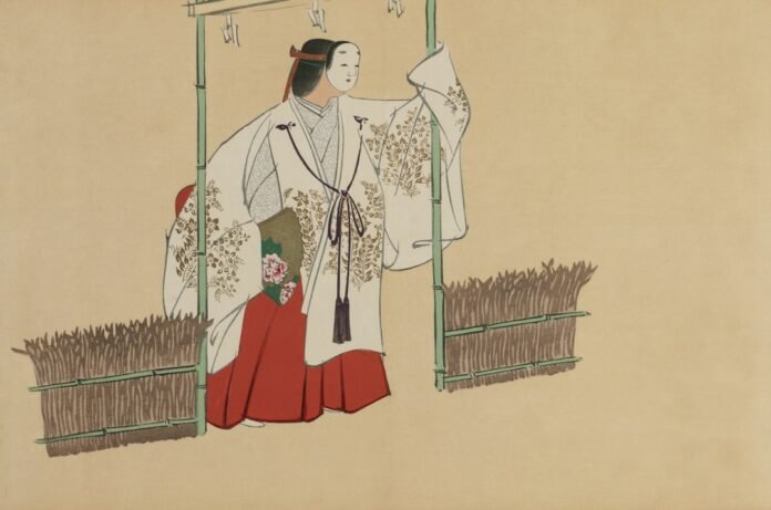 Woman in traditional japanese attire with bamboo structures