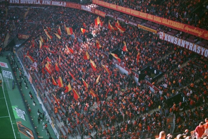 A large crowd of people at a soccer game