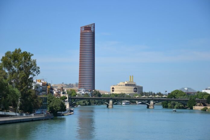 brown concrete building near body of water during daytime