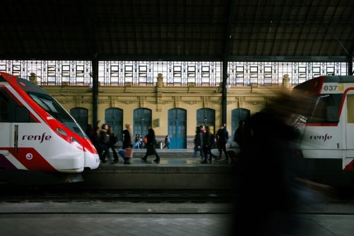 view photography of red and white train station