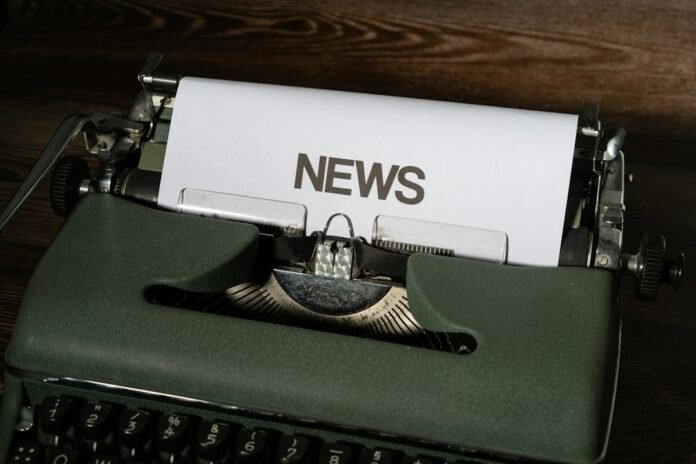 image_1793433637930 a close up of a typewriter with news paper on it